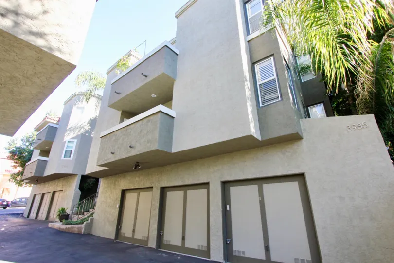 Villas having balconies and parking space wtih trees in Uptown Villas West of Hillcrest