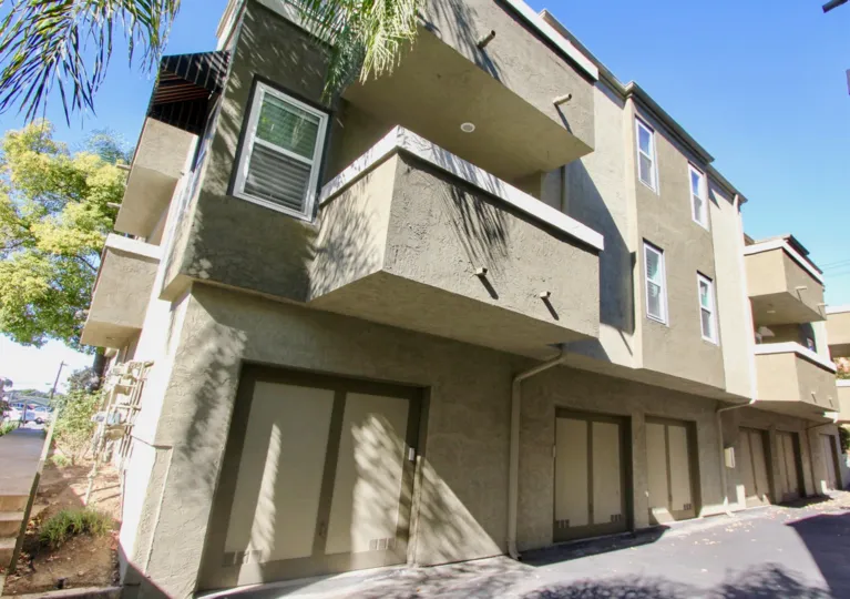 Imposing apartment building in uptown Villas West with intimate back parking places