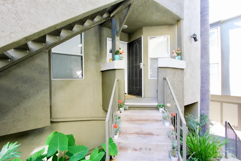 Steps up to the entrance of a unit at Uptown Villas West in Hillcrest California