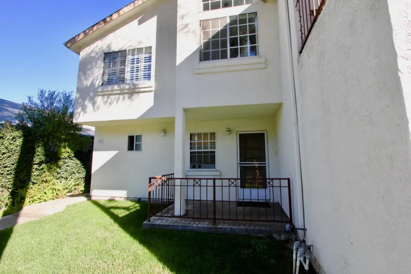 A sunn day with entrance approach in a house with lawn in Uptown West of Hillcrest