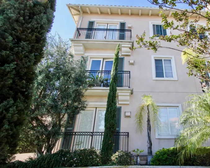 A sunny day in the area of Villa Portofino, outside, palm trees, highrise, balconies