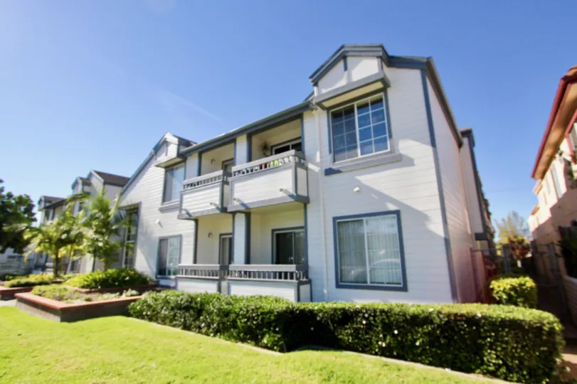 A two-storey townhome with blue and white motif in the Windemere Court neighborhood.