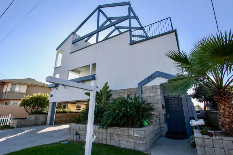 Three story housing with blue door at Alejandra in Imperial Beach California