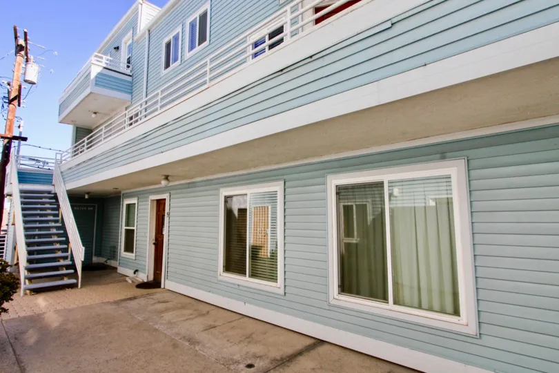 Two story housing with attached stairway at Coastwalk Townhomes in Imperial Beach California