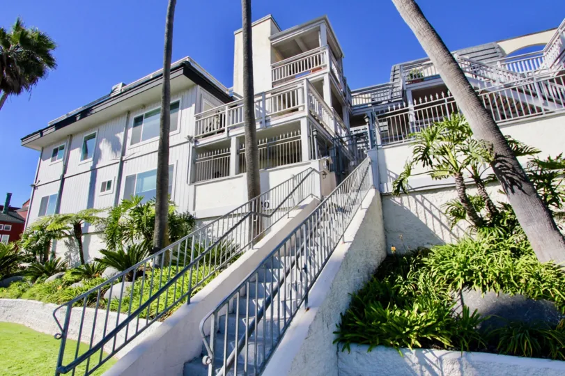 Warm weather with green trees and long stair cases in Cortez community.