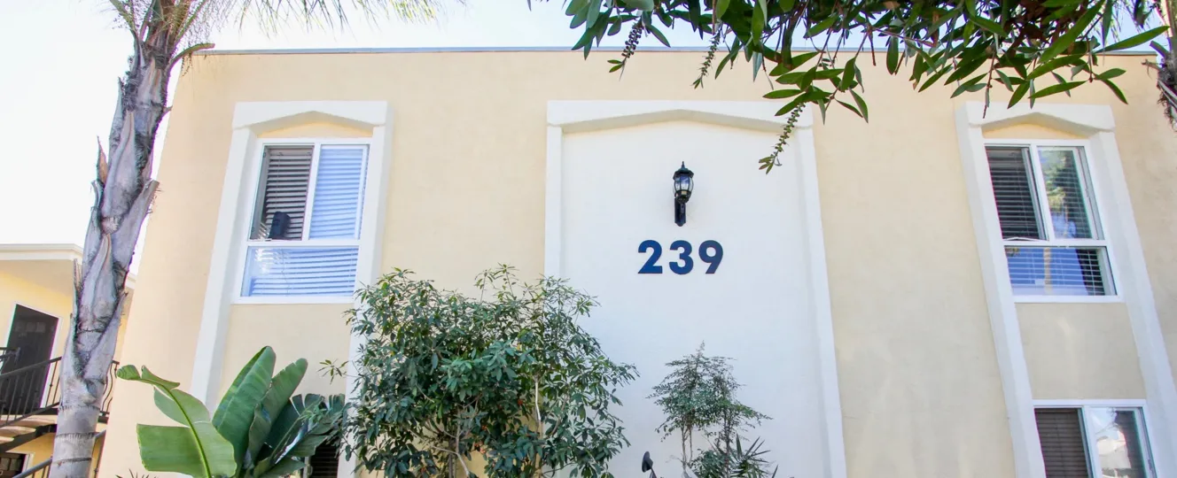 Address on the side of a building in black lettering at Ebony Estates in Imperial Beach CA