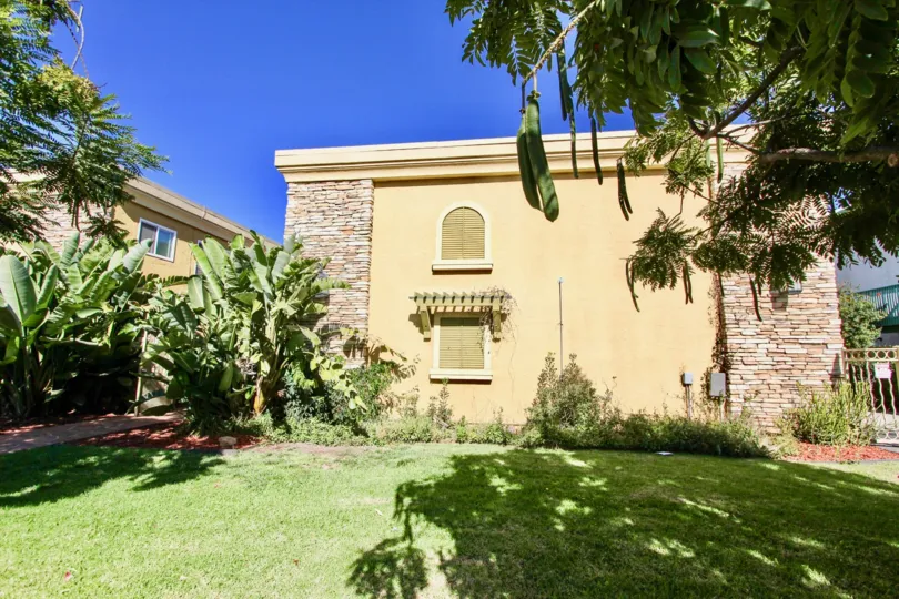 Two story condos with yard and trees at Holly Avenue Condos in Imperial Beach CA
