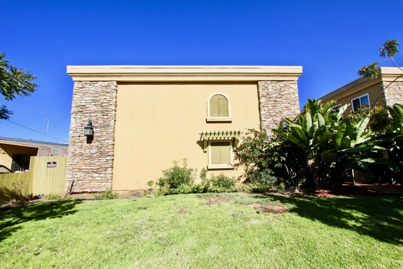 The sunny lawn of a condo at Holly Avenue Condos in Imperial Beach, California.