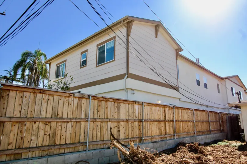 Two story building near fence at Holly Avenue in Imperial Beach California