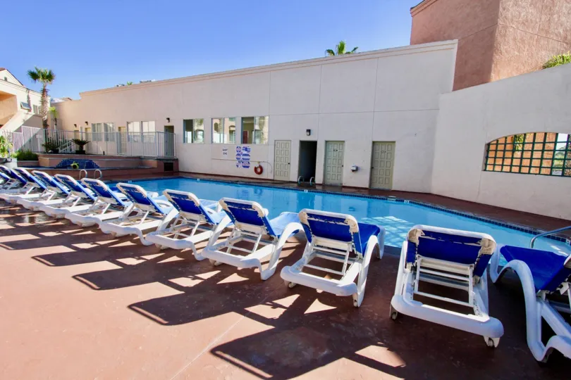 A sunny day in Imperial Beach Club with swimming pool and chairs to take rest and relax