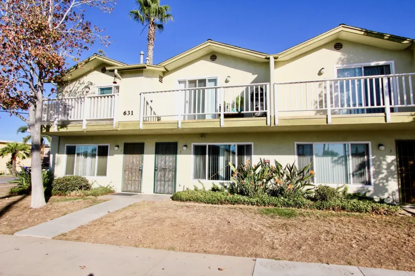 The villa in Imperial Heights has trees and grass aside of the door