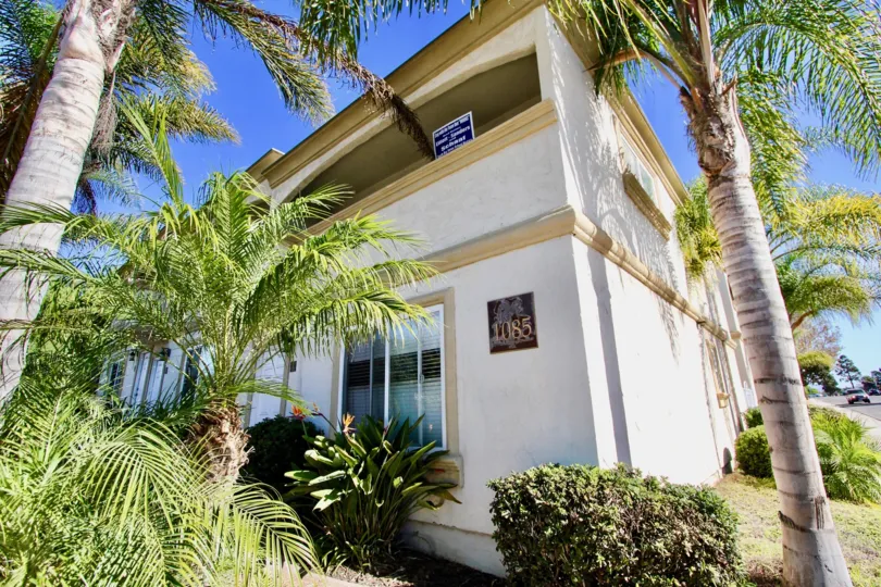 Two story white and brown residential units at Imperial Palms in Imperial Beach California