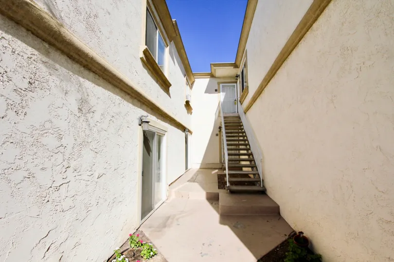 Walkway between residential buildings at Imperial Palms in Imperial Beach California