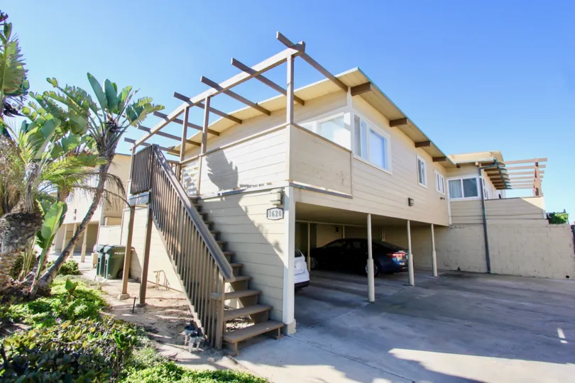 Two story housing with attached stairway and parking at La Boca Rio in Imperial Beach California