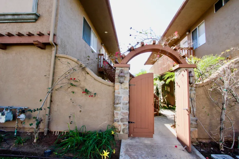 Wooden gateway between residential units at On Donax in Imperial Beach California