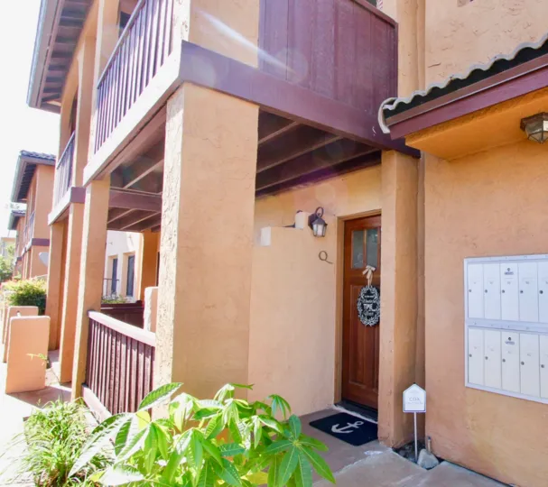 A mat in placed in the front of the door with anchor symbol at the On Holly community