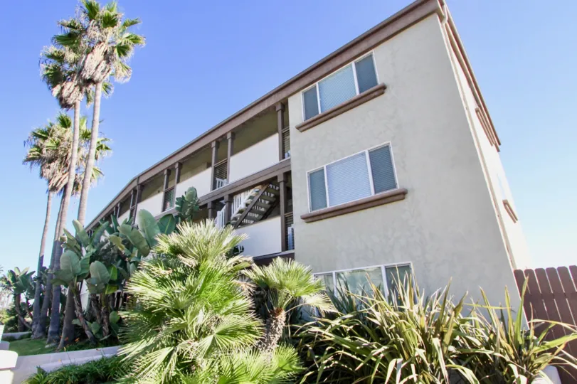 Grass and Palm trees beside Building at On Seacoast, Imperial Beach, California