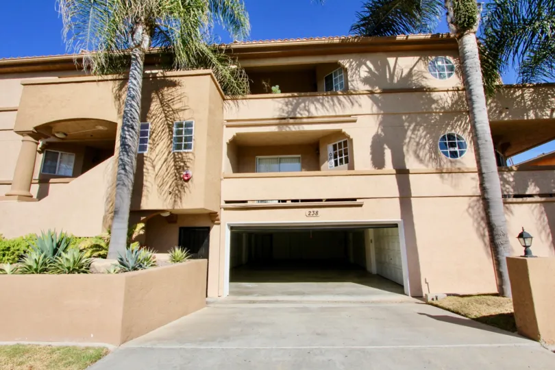 Playa Flores at Imperial Beach, California has a well decorated entrance with two pine tress at both side.