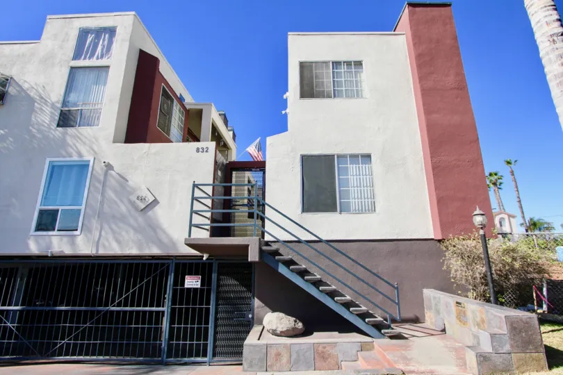 Three story housing with underground parking and marble walkway at Riviera Beach & Bay Villas in Imperial Beach CA
