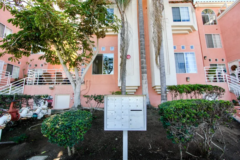 Two story hot pink residential building at Seaside Villas in Imperial Beach CA