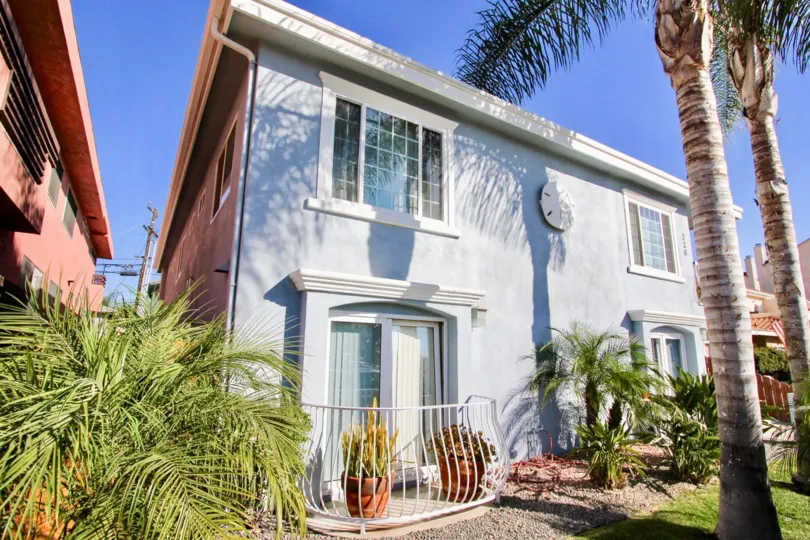 Two story blue building with large egg decoration at Shauna Shores in Imperial Beach CA
