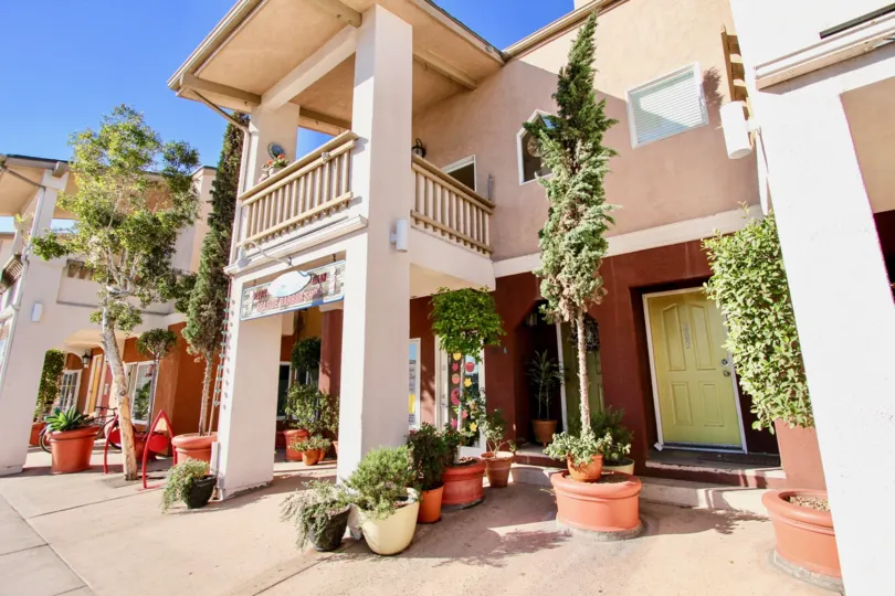 Two story pink residence in Shopkeeper at the Beach in Imperial Beach California