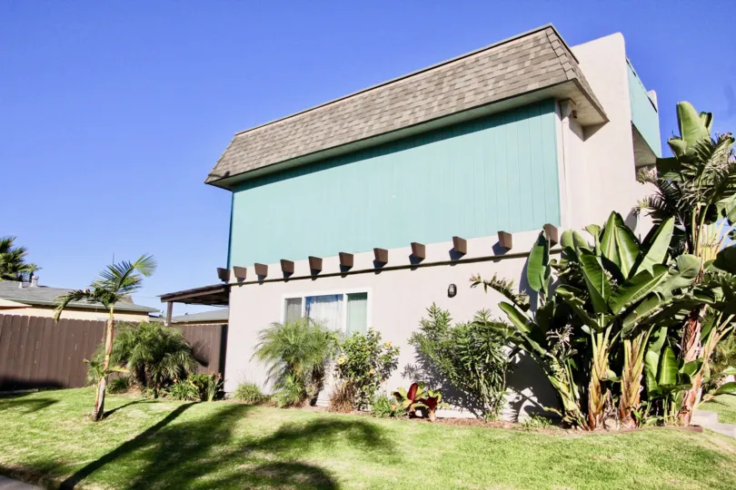 Two story housing surrounded by palm trees at Silver Strand Gardens in Imperial Beach California