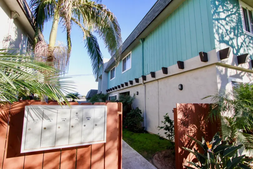 Wooden gate & mail boxes near residence at Silver Strand Gardens in Imperial Beach CA