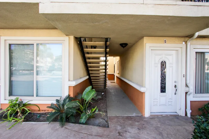 Corridor between two properties with a staircase in South Coronardo Shores