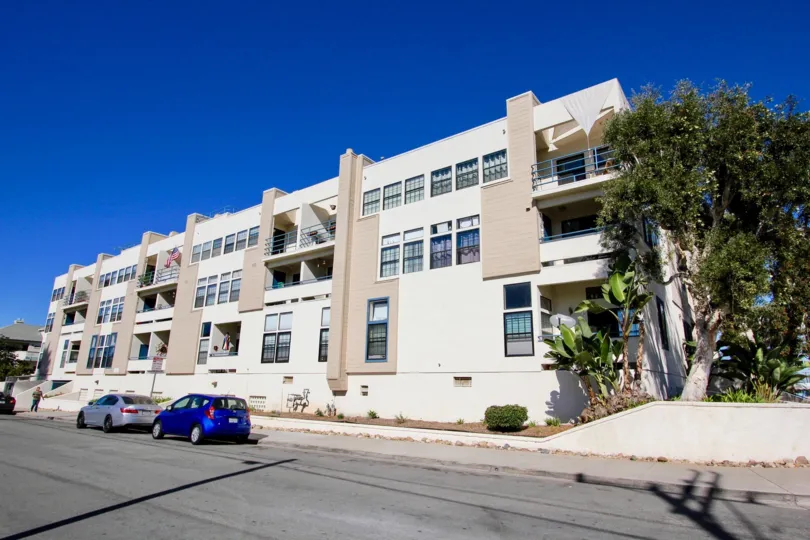 Three story residential buildings near a street at Summer Sea in Imperial Beach California