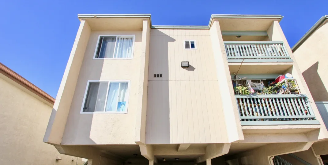 A sunny upward view of the luxurious Surf & Sand Condominiums in Imperial Beach, California.