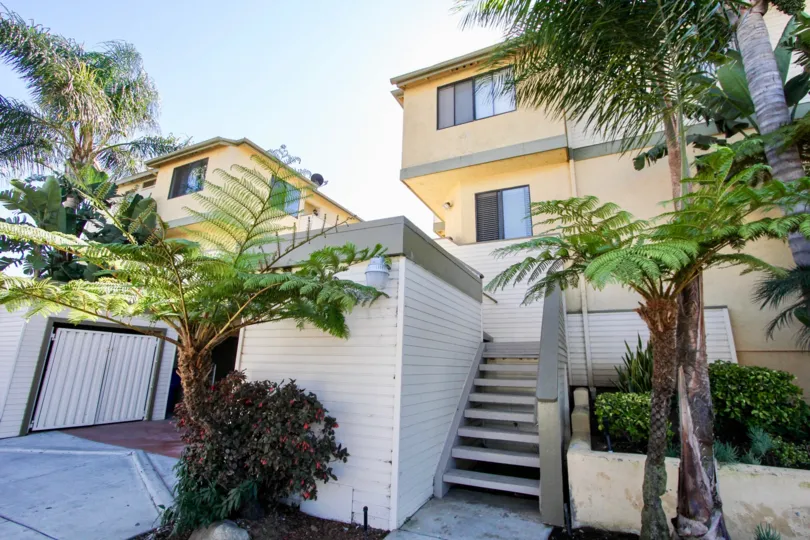 The Tradewinds apartments with steps and trees in the front side