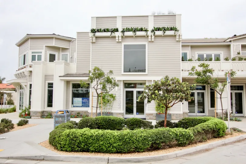 The apartment marked with 100 is covered by grasses and plants
