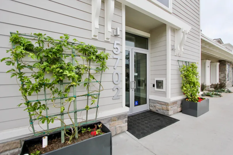 White building with black framed windows at 10 West in La Jolla California