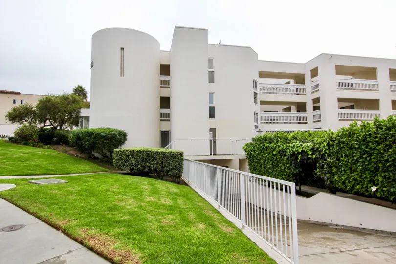 Hilly terrain lawn with underground parking facility on 100 Coast.