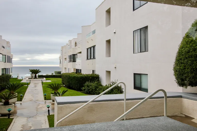 Three story housing with walkway and stairs at 100 Coast in La Jolla California