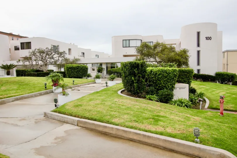 Lush green lawns and modern architecture at 100 Coast in La Jolla, California