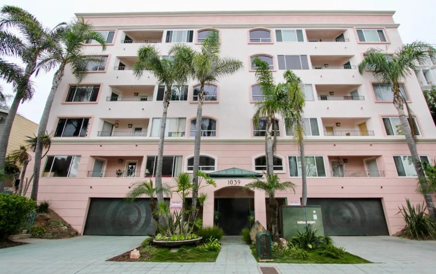 An upscale, five story apartment complex, surrounded by beautiful palm trees, at 1039 Coast Blvd. South in the city of La Jolla, California.