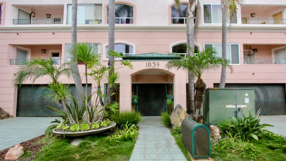 A beautiful shot of the cozy salmon 1039 Coast Blvd South community in La Jolla, California