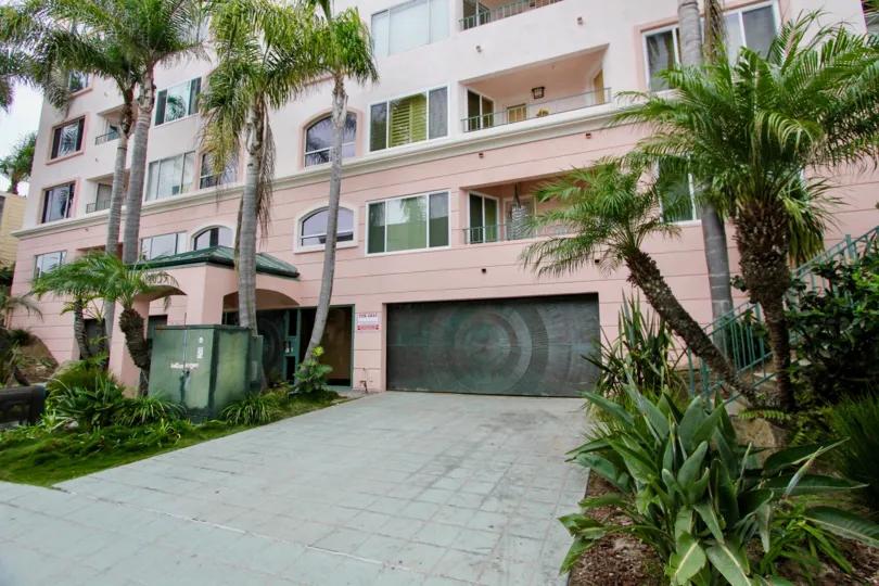 Gray tile driveway leading to garage inside 1039 Coast Blvd South in La Jolla CA
