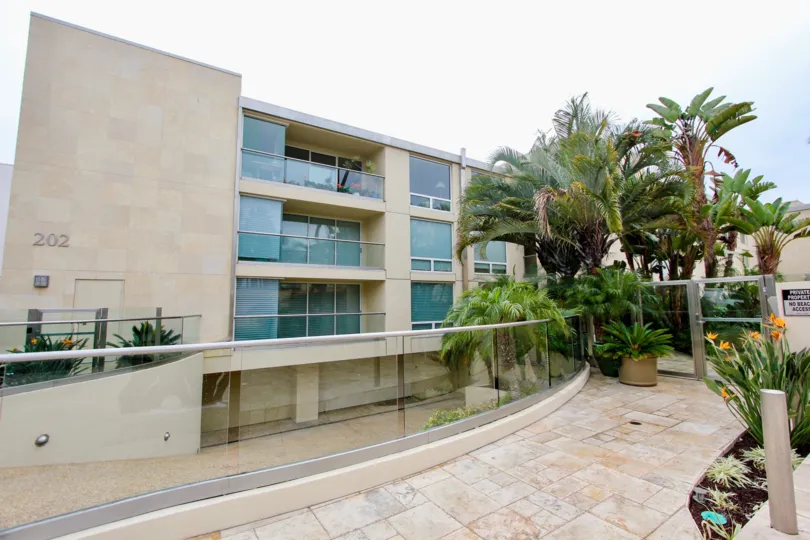 Four story residential units with blue glass at 202 Coast in La Jolla California