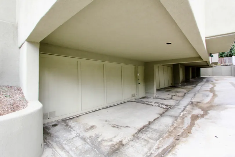 Giant garage doors near wet pavement in 265 Coast at La Jolla CA