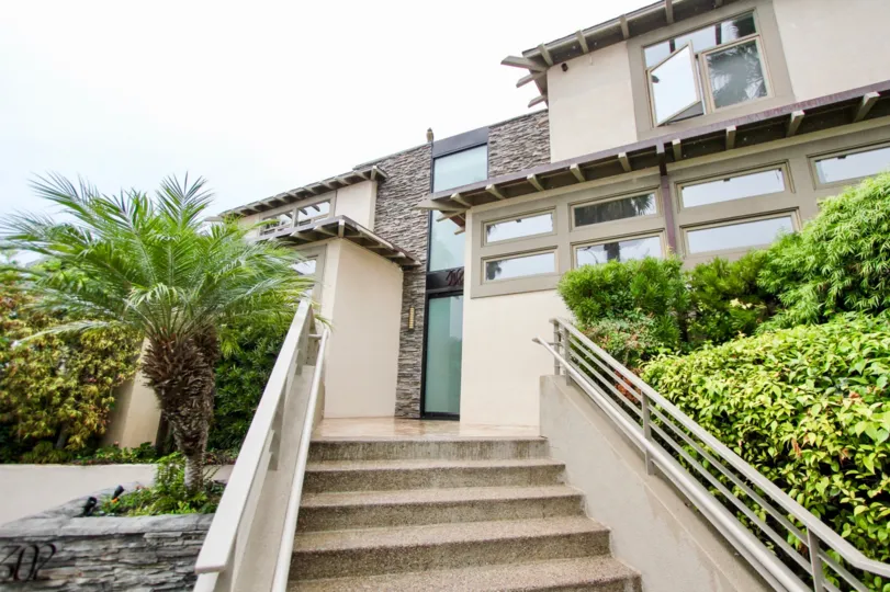Stairway leading to glass door entrance at 302 Prospect in La Jolla California