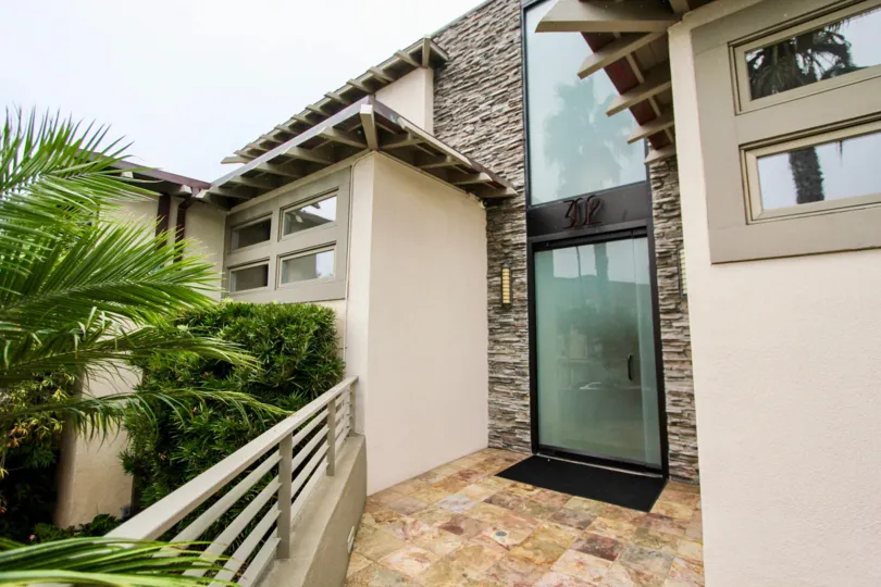 Door of 302 prospect is cover with plants and bushes