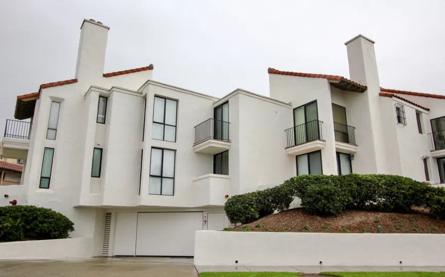 Three story white condos inside 303 Coast in La Jolla CA