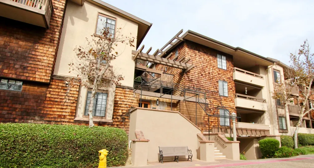 Three story units with plants and trees at Boardwalk in La Jolla California