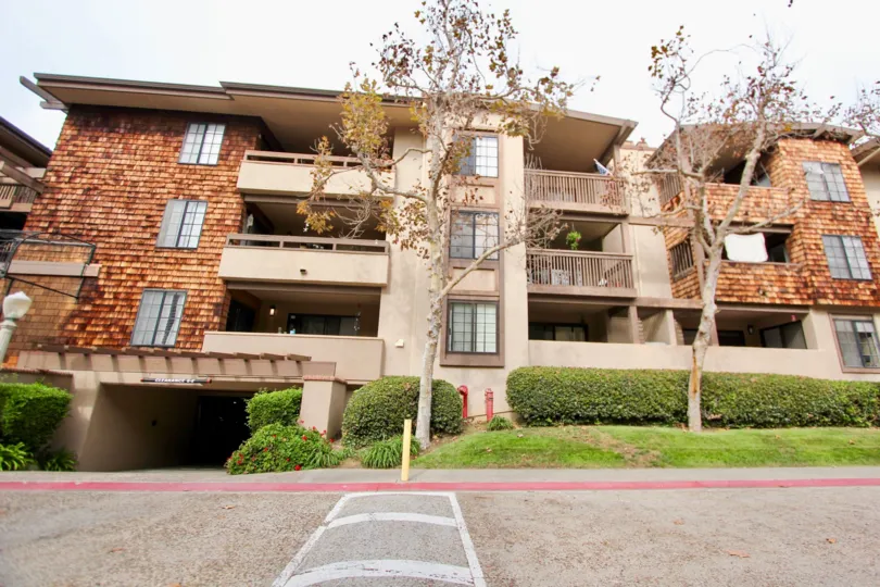 Four story wooden building with an underground parking lot in Boardwalk in La Jolla CA