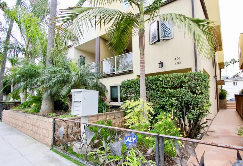 Purple flowers in front of condo hoe inside Bonair Street Condos in La Jolla CA