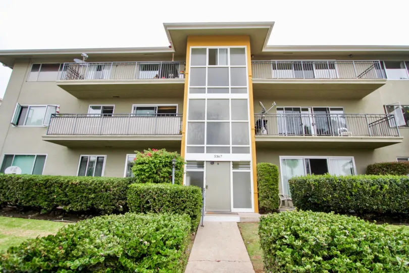 Thre story housing with walkway and plants at Capri Aire in La Jolla CA