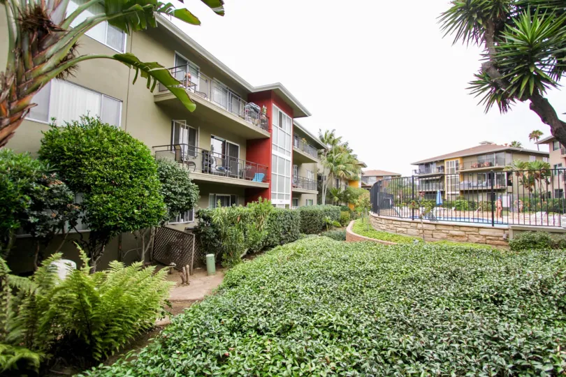 Three story gray residential units near ivy at Capri Aire in La Jolla CA